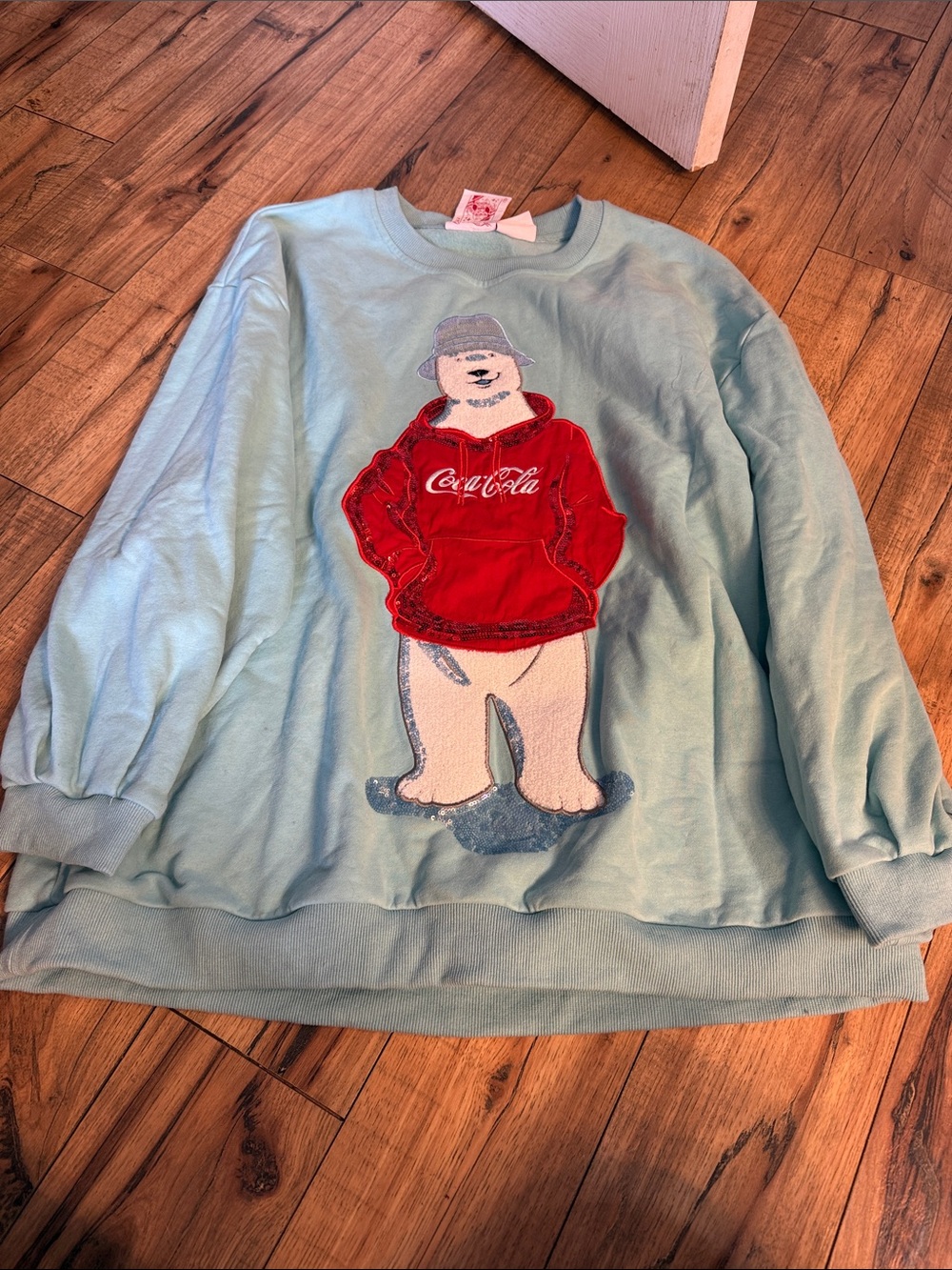QUEEN OF SPARKLES Light Blue Sweater with Red Coca-Cola Polar Bear